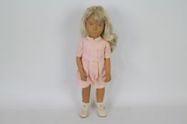 Trendon Ltd - Sasha Doll - An unboxed circa 1980 blonde Sasha doll with pink belted dress and white