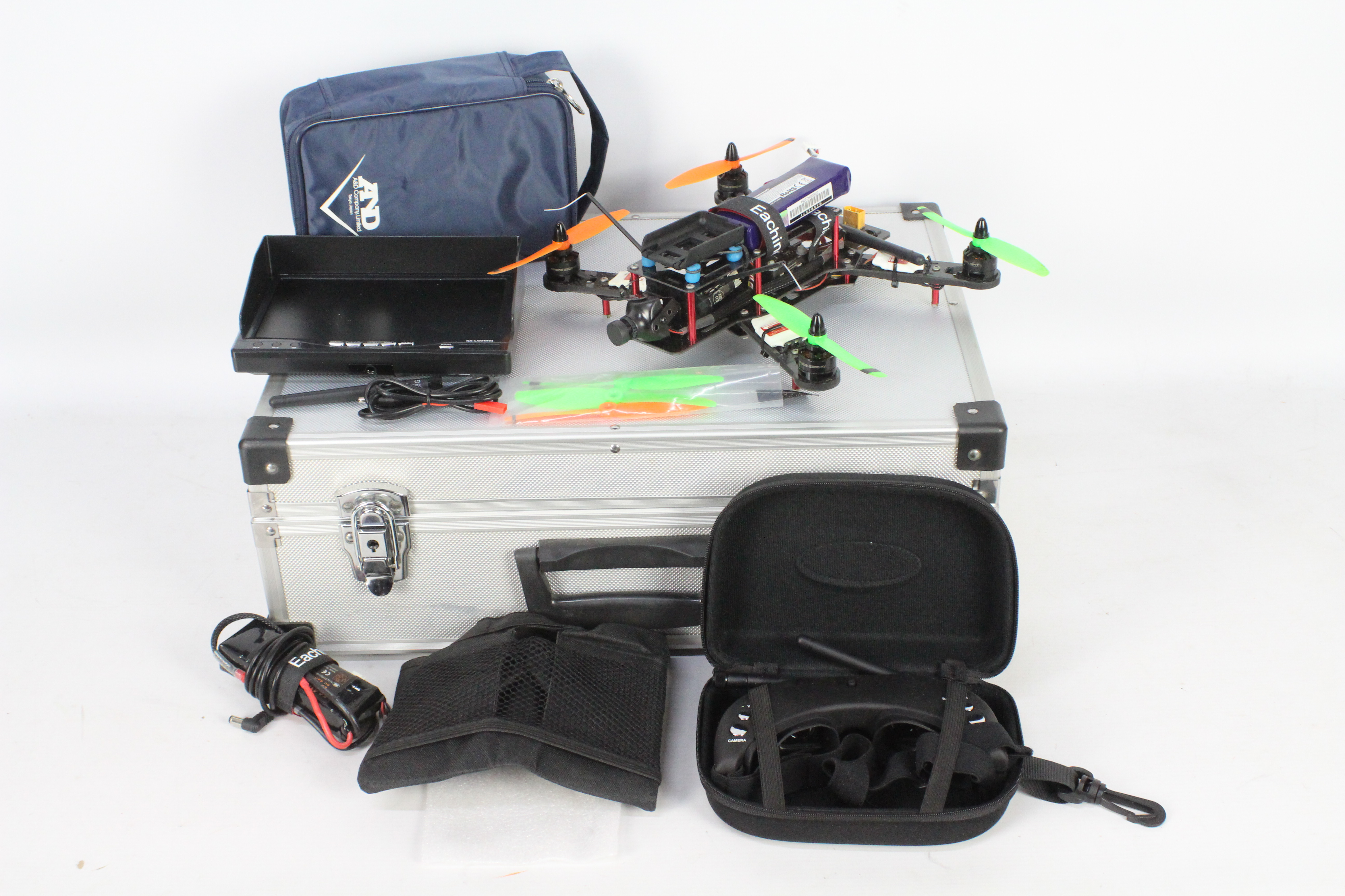 A Eachine carbon fibre drone built from a kit with controllable camera and battery pack.