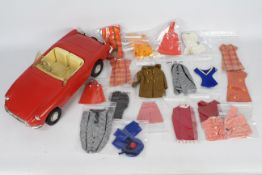 Sindy - Pedigree - A vintage 1970s Sindy MGB Roadster and 17 x bagged items of clothing and a