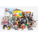 Lego - A large tub of loose Lego pieces and some part built models,