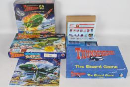 Collection of 3 Thunderbirds board games with 1 expansion pack.