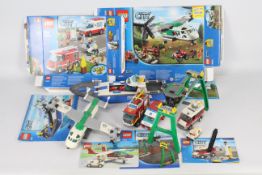 Lego - A collection of Lego vehicles including # 60021 Cargo Plane, # 7939 Gantry Crane, # 3366 Van,