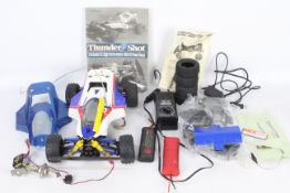 A thunder shot 1/10 scale 4WD off road racer with 2 spare batteries and high speed charger and