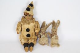 A vintage straw bodied filled Pierrot clown doll, with soft filled arms and hard legs,