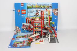 Lego - City Fire Station with helipad/copter/2 fire trucks.