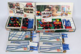 Lego - A boxed collection of vintage Lego railway sets and equipment.