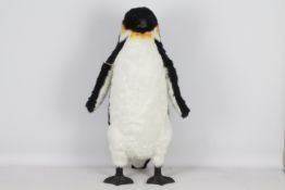 A very realistic-looking penguin with glass eyes. Penguin has polymer beak and feet.