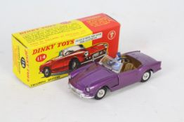 Dinky - A boxed # 114 Triumph Spitfire in the rare purple colour.