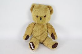 Pedigree - A vintage 1950 Pedigree golden mohair bear, with jointed arms and legs,