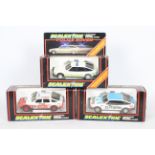 Scalextric - Three boxed Scalextric Rover 3500 slot cars.