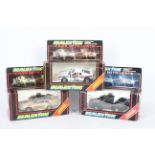 Scalextric - Three boxed Scalextric slot cars with lights.