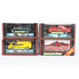 Scalextric - Four boxed Scalextric slot cars.