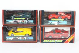 Scalextric - Four boxed Scalextric slot cars.