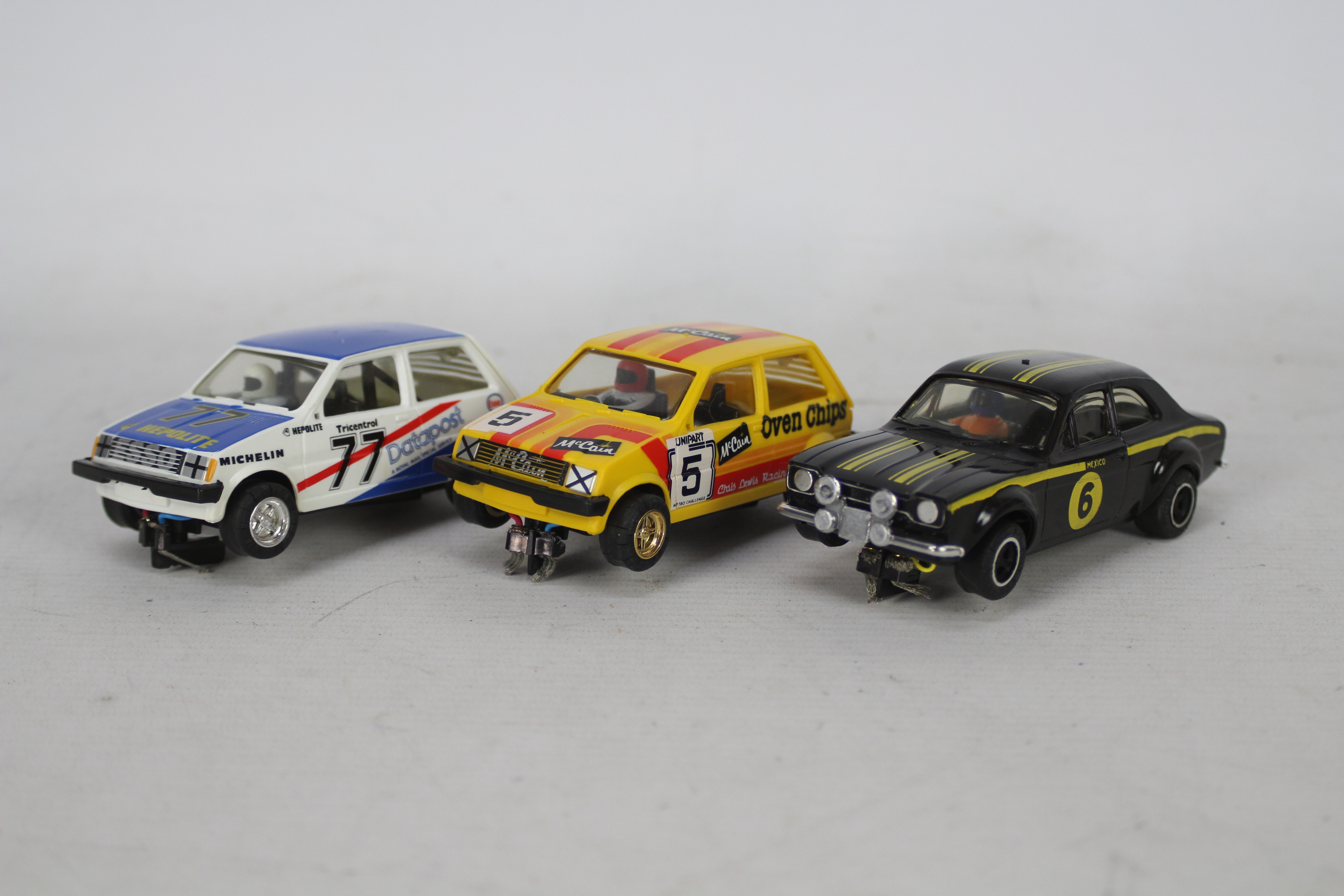 Scalextric - Three unboxed Scalextric rally themed slot cars.