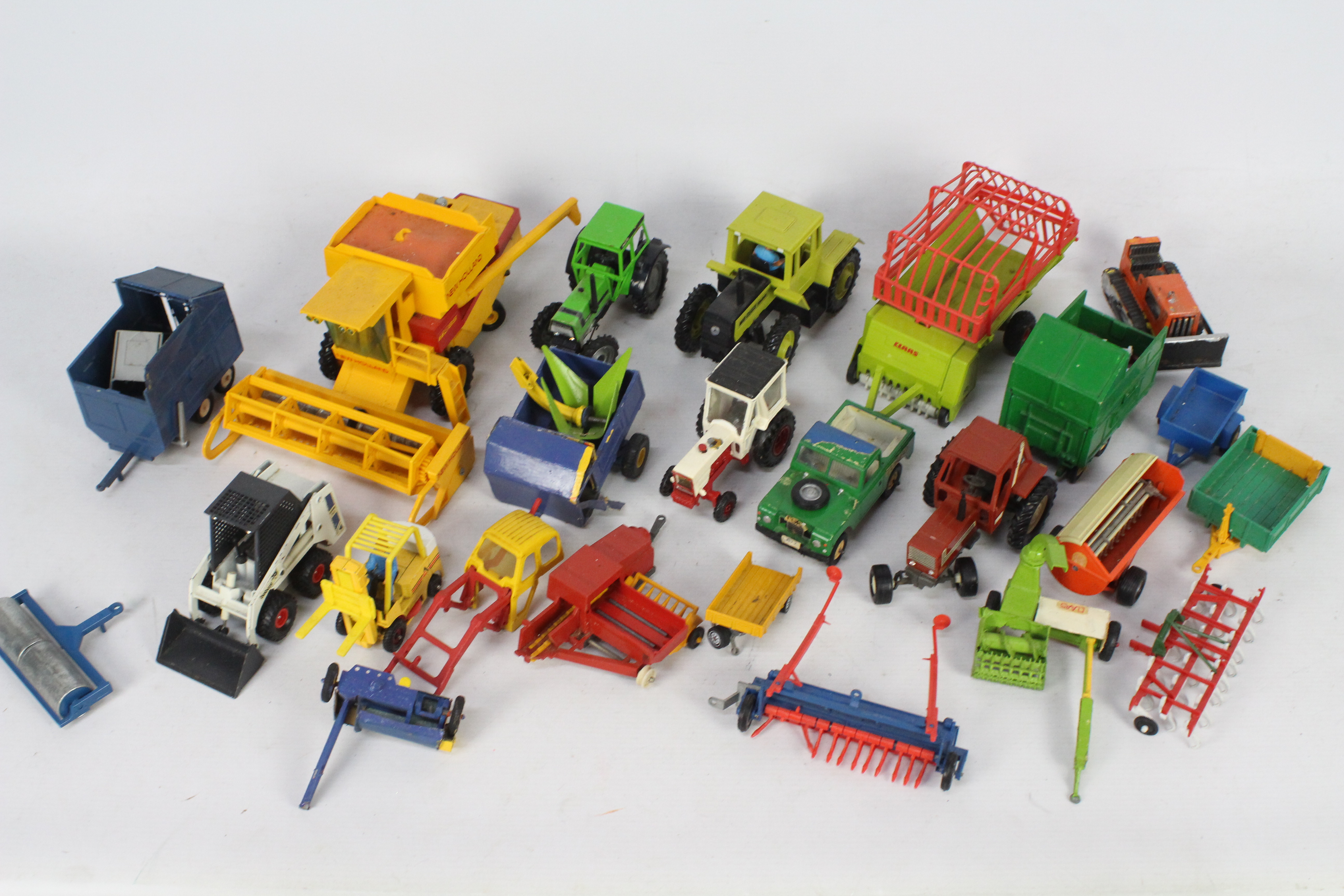 Britains - Corgi - Gama - A group of 20 x unboxed vehicles and trailers including Gama Bobcat,