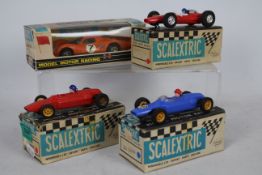 Scalextric - Four boxed vintage Scalextric slot cars.