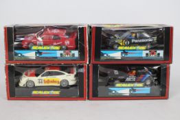 Scalextric - Four boxed Scalextric slot cars.