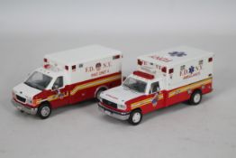 Code 3 Collectibles - 2 x limited edition FDNY Ambulance models in 1:64 scale,