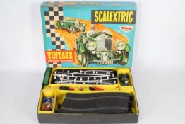 Scalextric - A boxed vintage and hard to find Scalextric V33 'Vintage Motor Racing' Set.