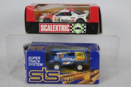 STS (Exin), Scalextric - Two boxed model slot cars,