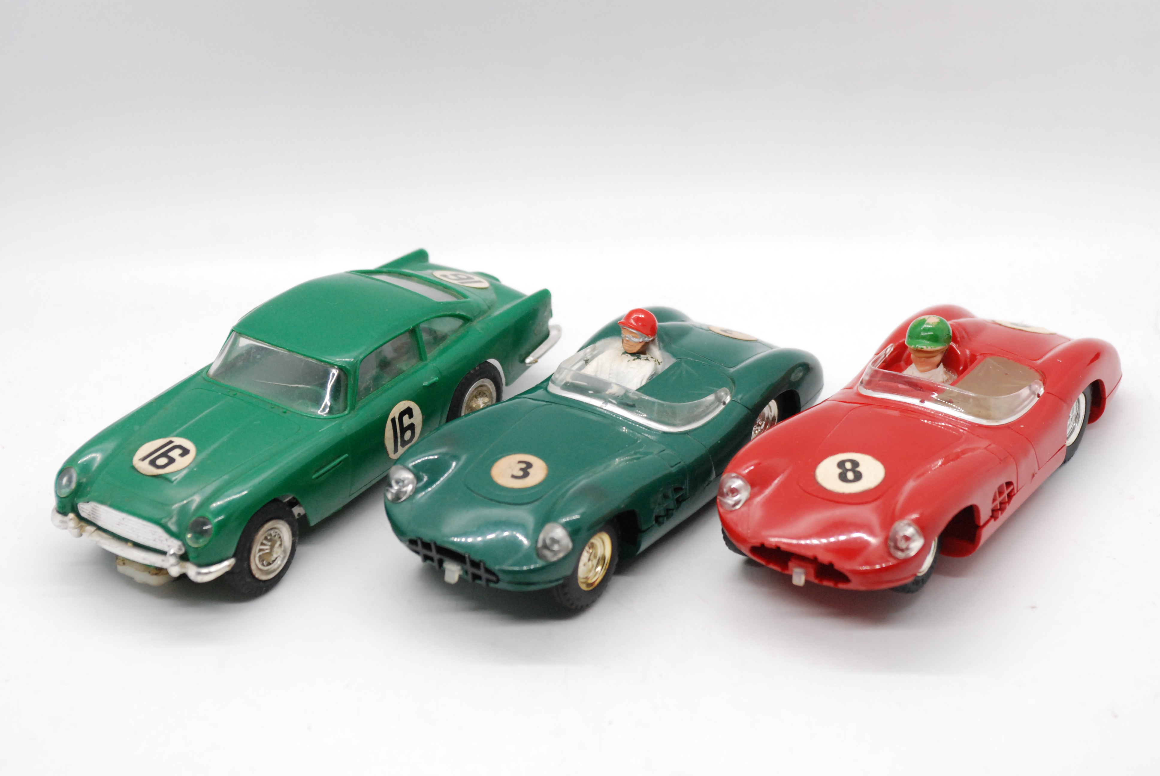 Scalextric, Revell - Three unboxed vintage Scalextric Aston Martin slot cars.