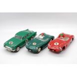 Scalextric, Revell - Three unboxed vintage Scalextric Aston Martin slot cars.