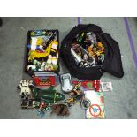 A box and a bag containing - Thunderbirds - Tracy Island - Action Man - Transformers - Snoopy &