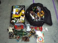 A box and a bag containing - Thunderbirds - Tracy Island - Action Man - Transformers - Snoopy &