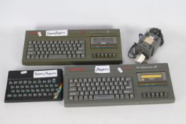 A collection of 3 Sinclair ZX Spectrum's including 2 x 128k ZX Spectrum's +2 and 1 ZX Spectrum 48k.