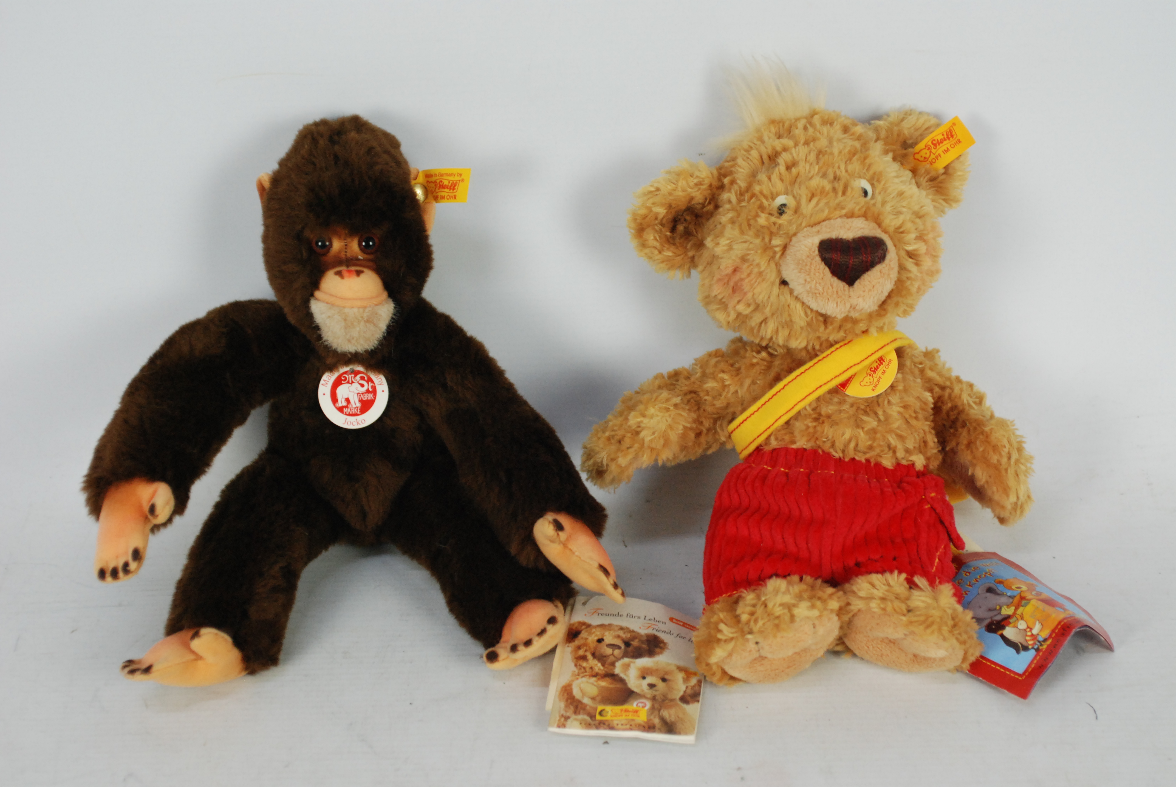 Steiff - Two Steiff bears - Lot includes a 'Jocko' monkey with yellow tag on its ear.