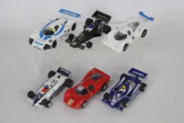 Scalextric - A grid of six unboxed Scalextric F1 and Sports cars.