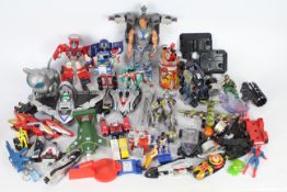 A collection of Transformers action figures from 1990's - some complete some are parts - used