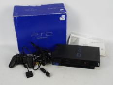 Play Station 2 - a Playstation 2 gaming console by Sony with controller,
