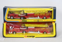 Corgi - A boxed pair of Corgi #1143 American LaFrance Aerial Ladder Rescue Trucks.