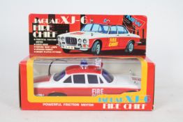 Lucky Toys - A boxed vintage Lucky Toys#3113FB Jaguar XJ-6 Fire Chief plastic friction powered car.