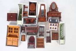 Wooden detailed dolls house furniture including chairs, crib, drawers and even a small doll house.