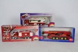 Siku - Three boxed 1:50 and 1:55 scale diecast European Fire Appliances from Siku.