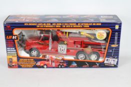 New Bright - A boxed New Bright #331 1:18 scale 9.6V Radi Controlled Ladder Rescue Fire Engine.