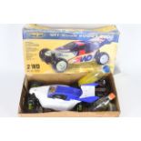 A Carson 2WD off road buggy 2000 1/10 scale petrol RC car with controller in original box with some