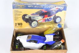 A Carson 2WD off road buggy 2000 1/10 scale petrol RC car with controller in original box with some