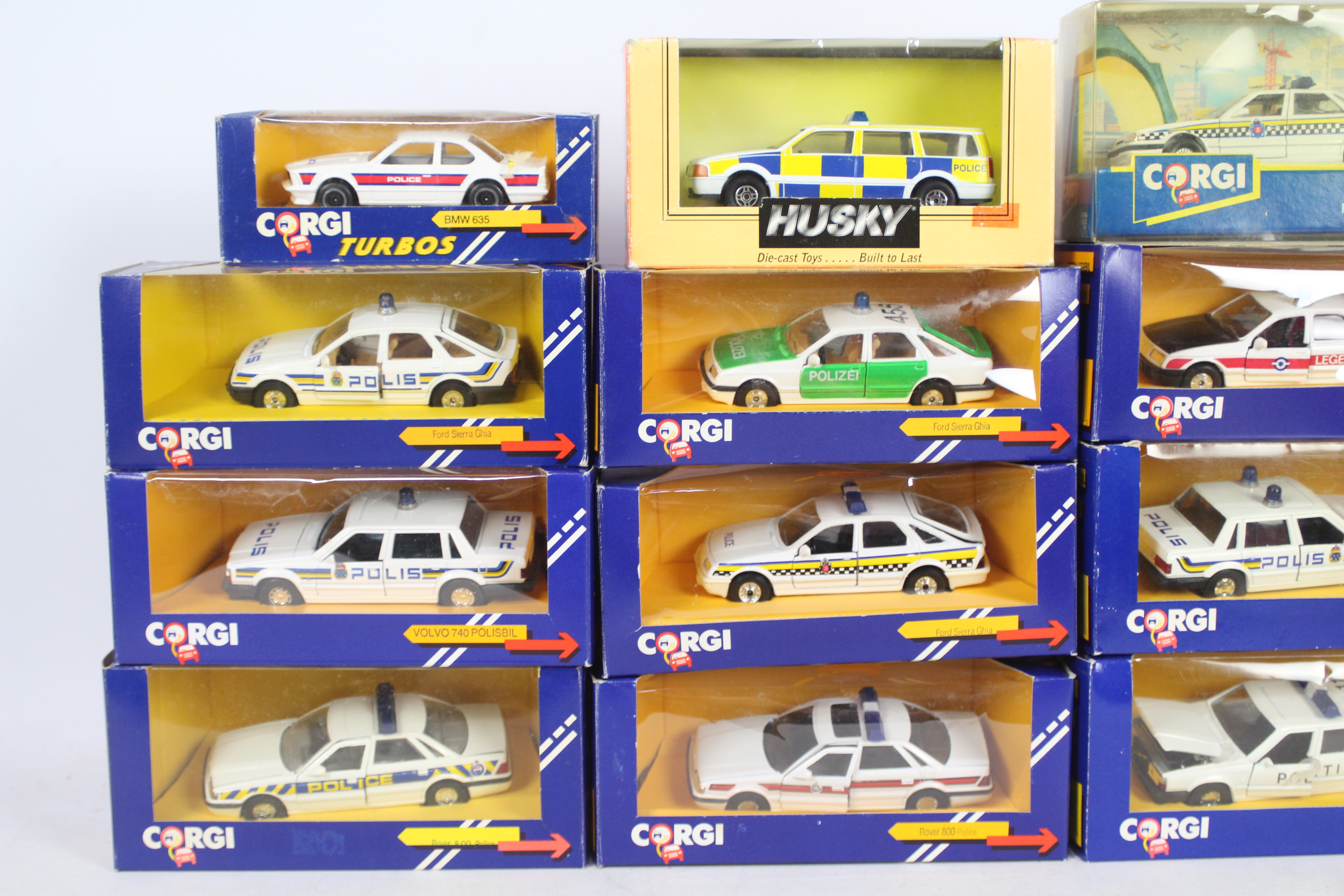 Corgi, Husky - A squad of 12 boxed diecast 'Police' cars predominately 1:43 scale by Corgi. - Image 2 of 3