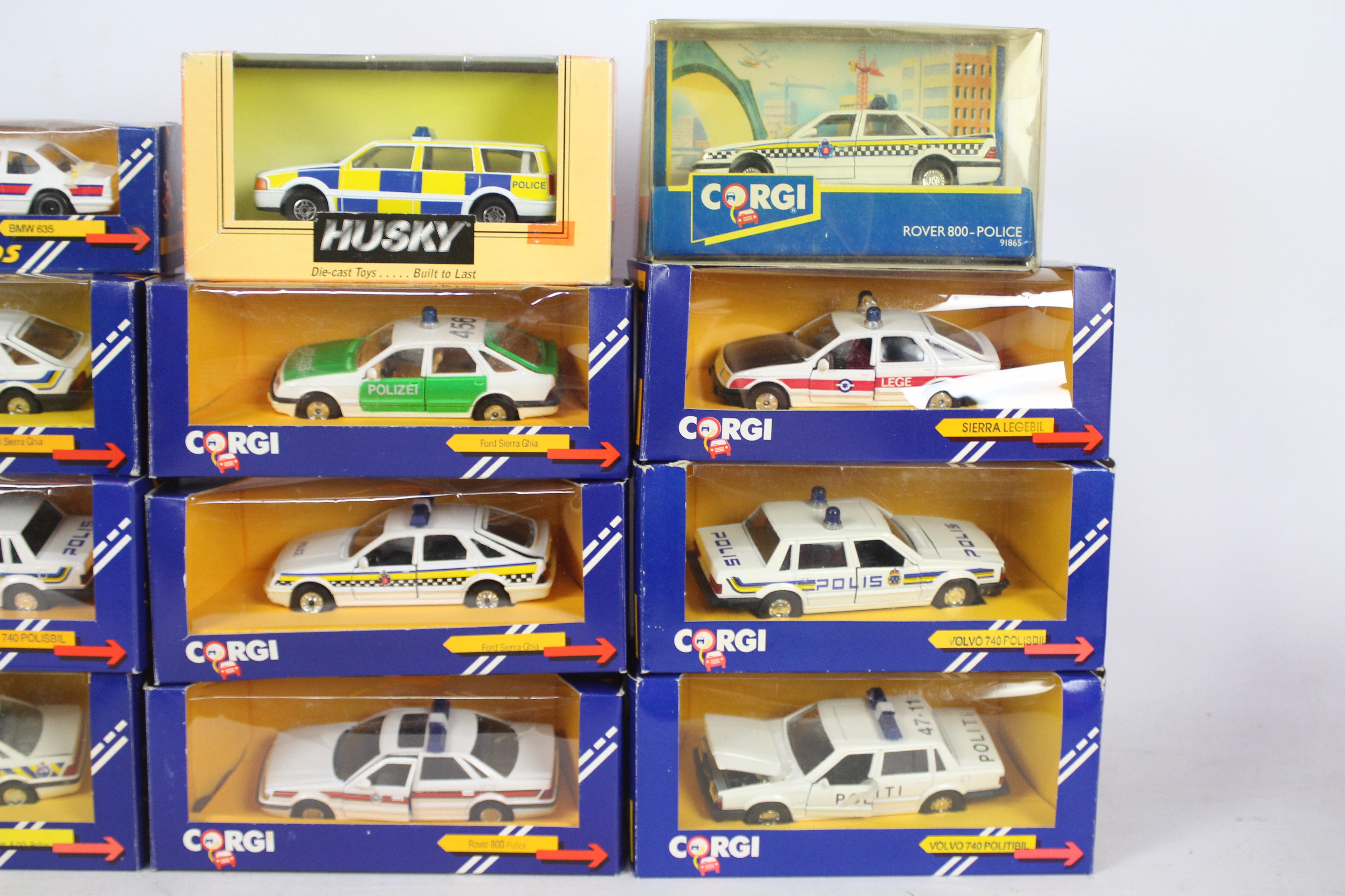 Corgi, Husky - A squad of 12 boxed diecast 'Police' cars predominately 1:43 scale by Corgi. - Image 3 of 3