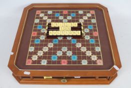 Franklin Mint - Scrabble - 24ct gold plated collectors edition with swivel plate on the bottom.