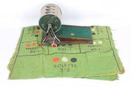 Rolette - A vintage Rolette game comprising of a metal drum with a cast metal frame on a wooden
