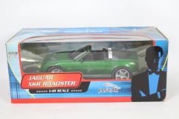 Paul's Model Art - James Bond - A boxed 1:18 scale Jaguar XKR Roadster from Die ANother Day # 10012.
