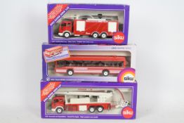 Siku - Three boxed 1:50 and 1:55 scale diecast European Fire Appliances from Siku.