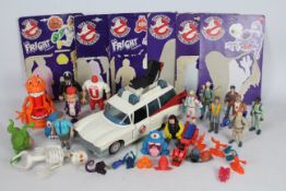 A large collection of Ghostbusters toys by Kenner - including ECTO-1, Slimer,
