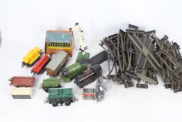 Hornby - Two unboxed Hornby O gauge clockwork locomotives, with six items of rolling stock,