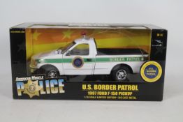 Ertl - A boxed Ertl 'American Muscle Police' 1:18 scale diecast 1997 Ford F-150 Pickup 'US Border