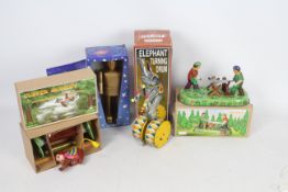 Joyou - Tobar - 4 x boxed clockwork tinplate toys including an Elephant on a drum, a Space Man,